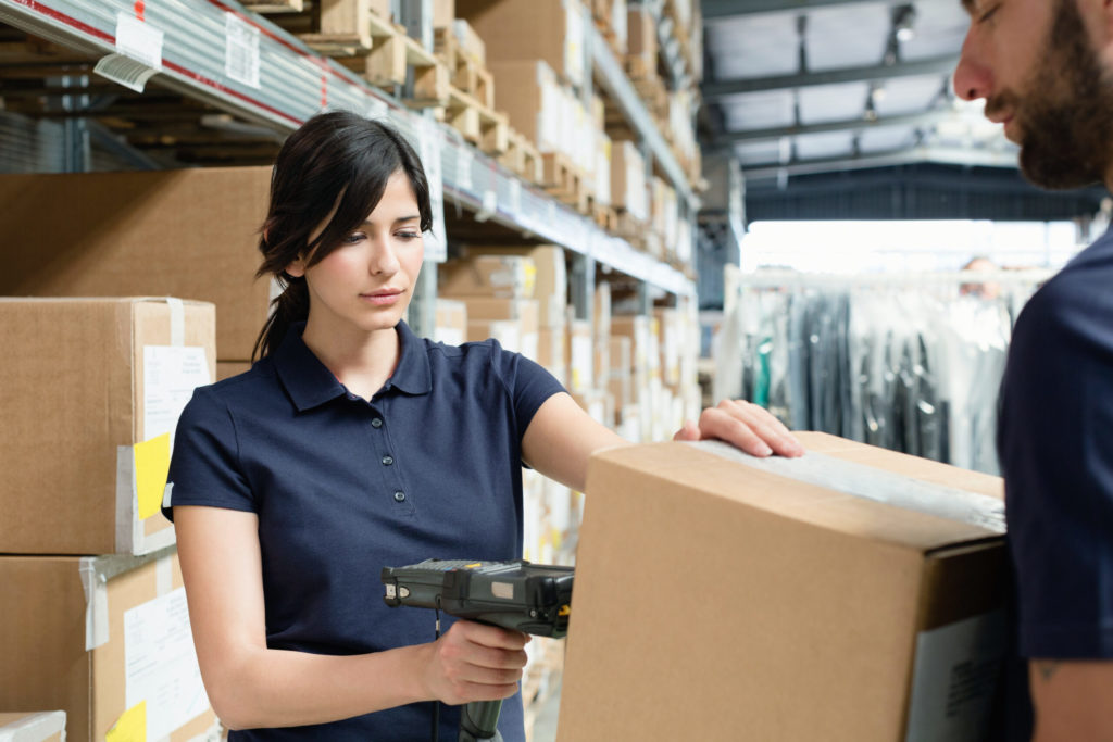 Warehouse workers scanning inventory into NetSuite after a successful TeamGDS implementation